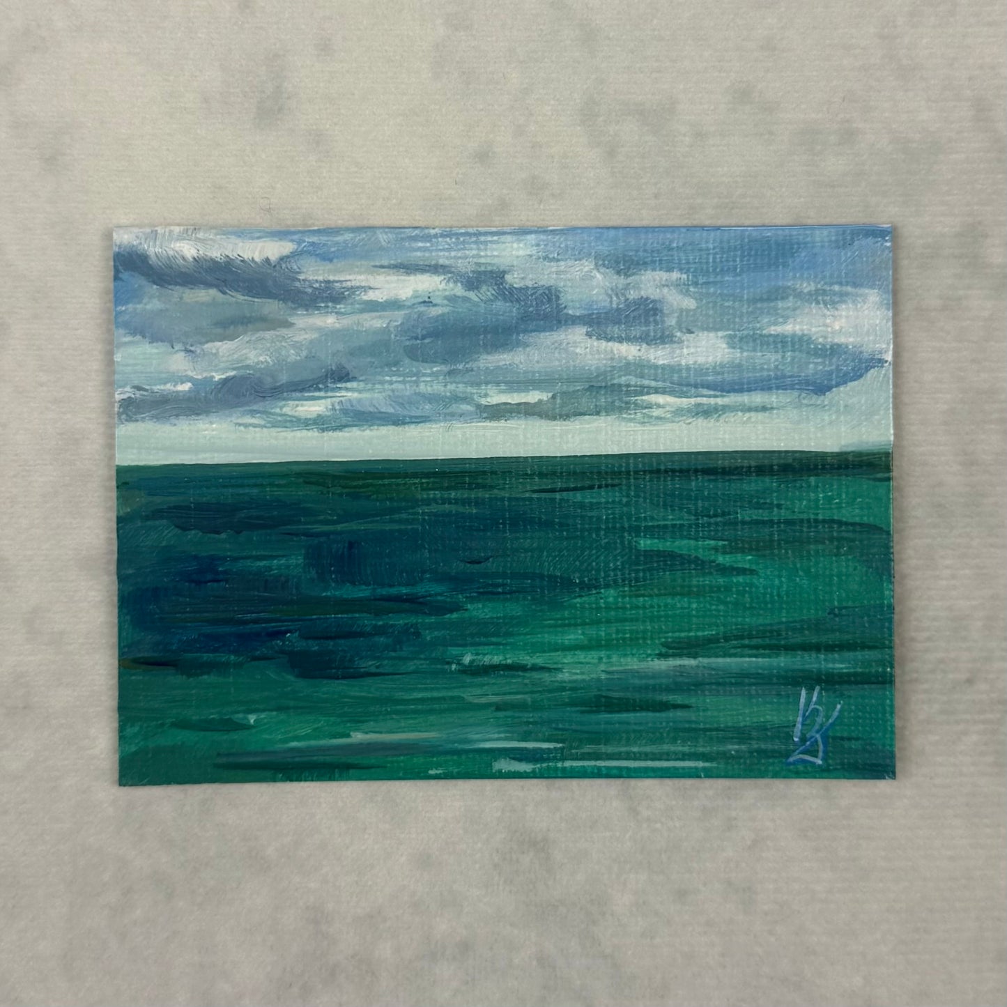 Big water. Gray clouds